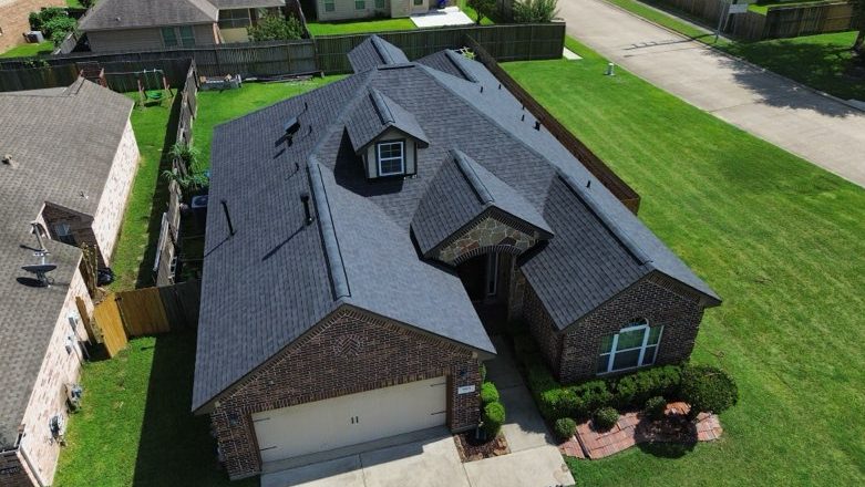alt="cool roof of asphalt material above view in Klein Texas"