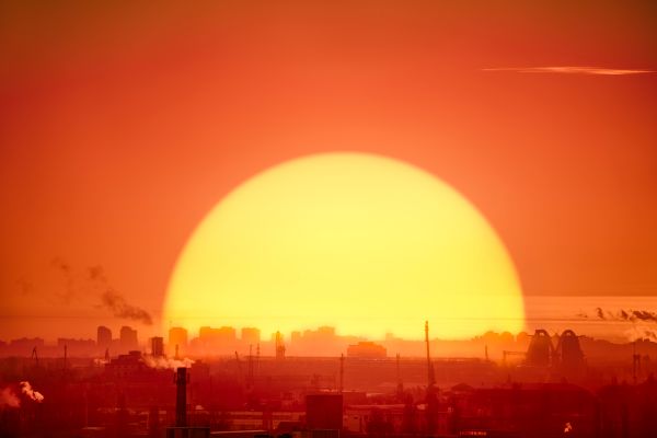 alt="sunset against city of houston for summertime"