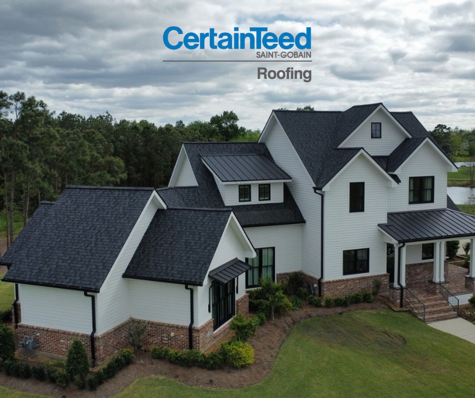 alt=" certainteed select shingle master home in Spring, black asphalt shingle roof on white house with green grass and cloudy sky"