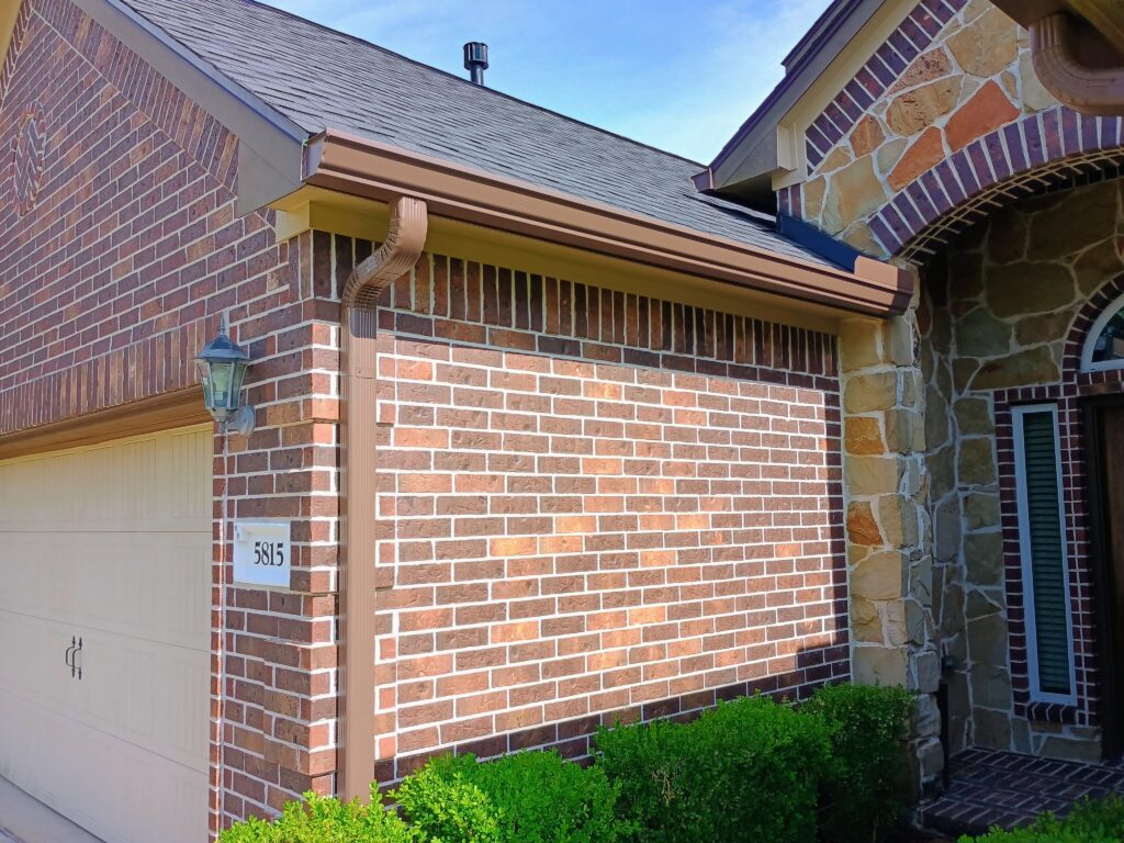 Stainless steel micro-mesh gutter guards being fitted onto a home in the Klein area.