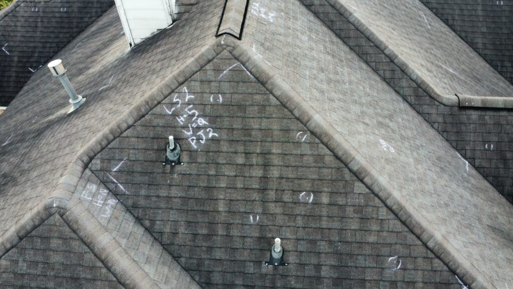 High-resolution drone roof inspection of a residential home in Spring, Texas.