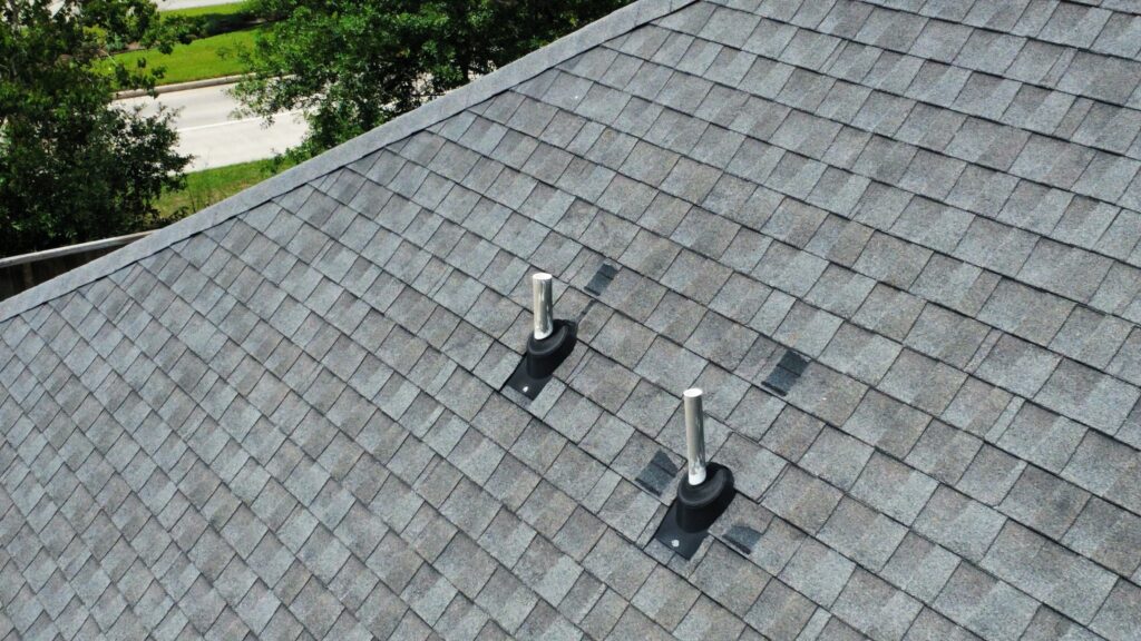 Replacing a cracked roof pipe boot during a maintenance repair.